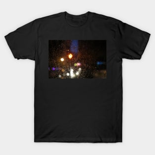 Deatil of raindrops on a car windshield at night T-Shirt